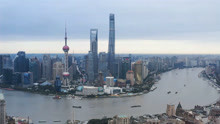 航拍上海黄浦江两岸的城市风光，密密麻麻的摩天大楼非常壮观