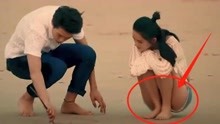 李沁在海边蹲下玩沙子，不料忘了穿的是超短裤，下秒观众疯狂截图